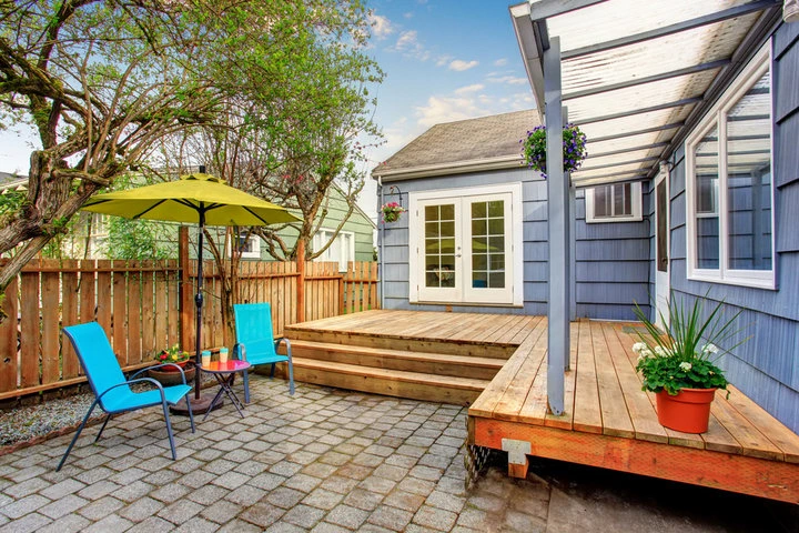Experienced Sacramento custom deck builders discussing outdoor deck plans with homeowners